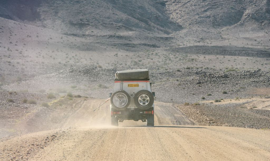 A Toyota Land Cruiser driving in the desert in Fish River Canyon