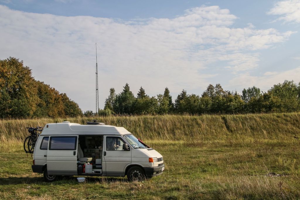 A Volkswagen Transporter T4 van boondocking on the Bug river bank near Malkinia, Poland
