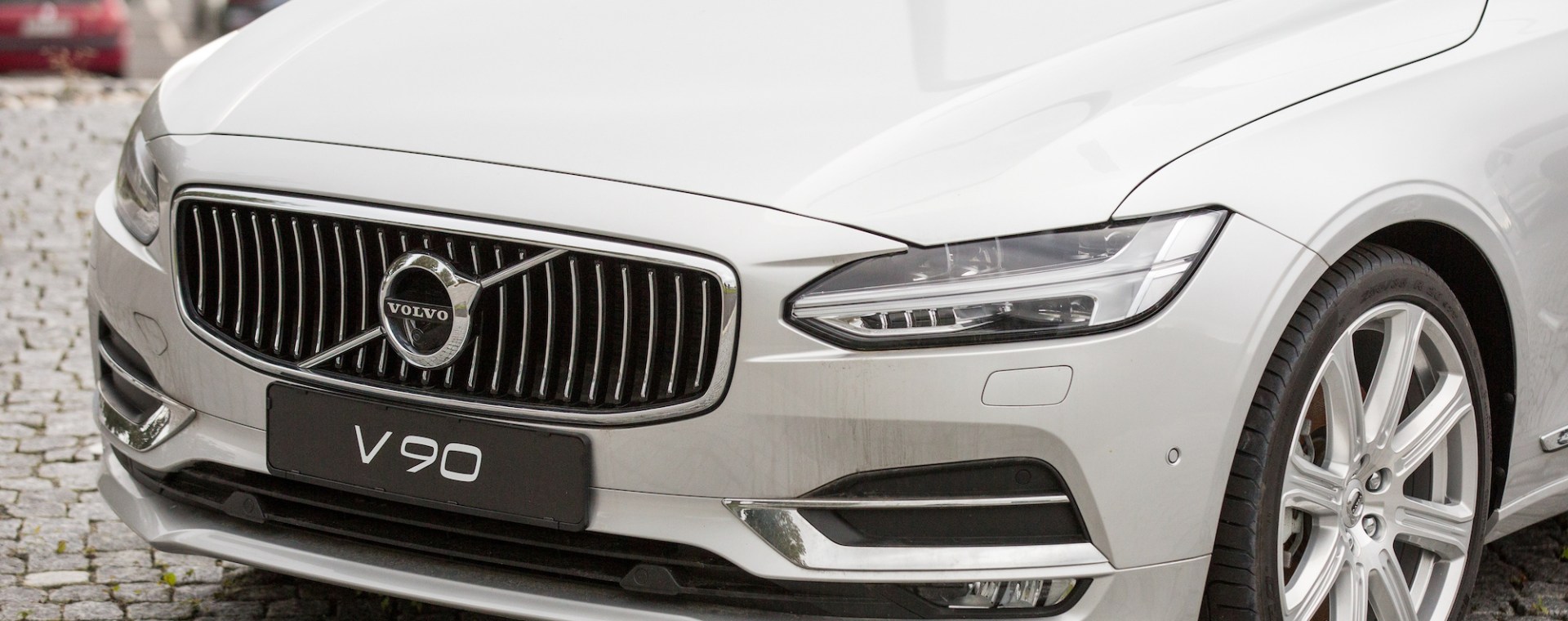 A white Volvo V90 luxury car is parked at the Volvo Car Corporation headquarters in Gothenburg, Sweden. Volvo is changing the way it names its models.