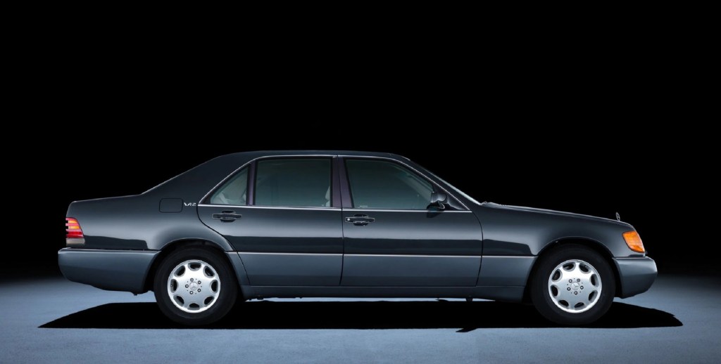 The side view of a black W140 Mercedes-Benz 600SEL S-Class