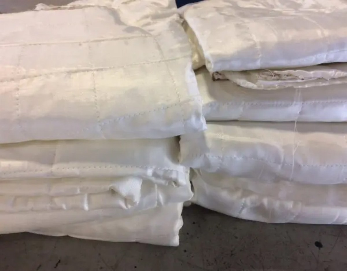 White Armormax bomb blankets. These blankets are available as an option for a bulletproof car