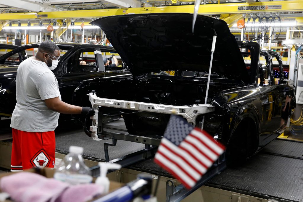 A line worker assembles Ford Motor Company's Ford Bronco on the line at their Michigan Assembly Plant