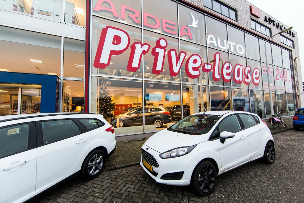 A Ford car showroom promotes the sale of private leases.