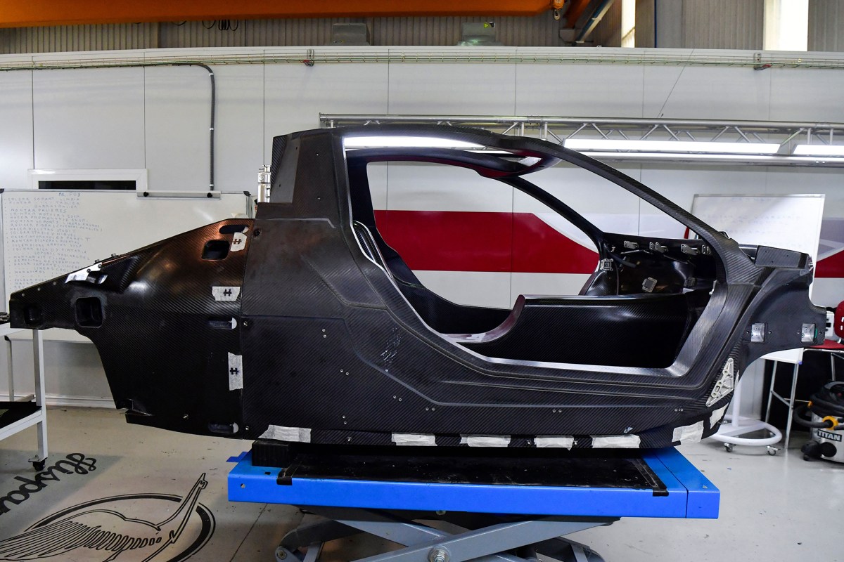 A carbon fiber car chassis on a production line.