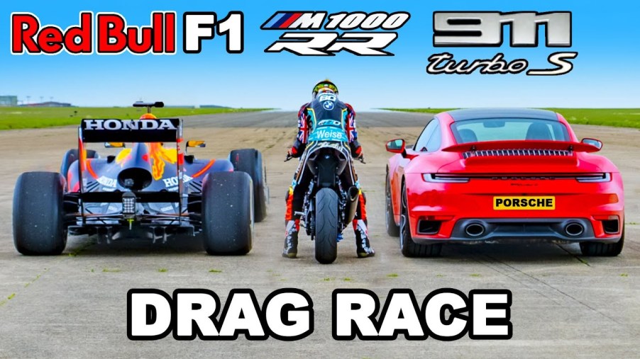 carwow feature image featuring a red bull f1 car (far left), BMW M100 RR superbike (center), and 2021 Porsche 911 Turbo S (right) preparing to drag race.