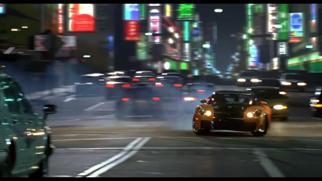 A scene The Fast and the Furious: Tokyo Drift featuring the character "Han" drifting in downtown Tokyo.