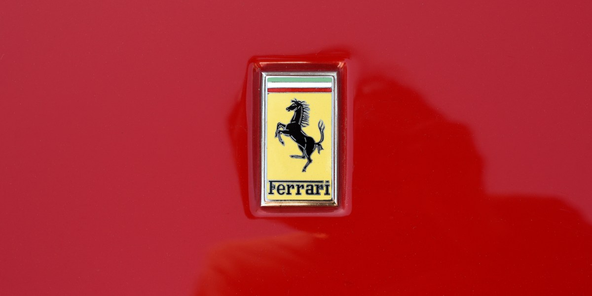 ferrari logo on red background