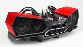 A red Lamborghini Bluetooth speaker featuring metal exhaust piping.