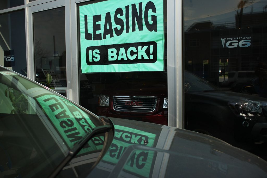 A leasing sign is displayed in a window