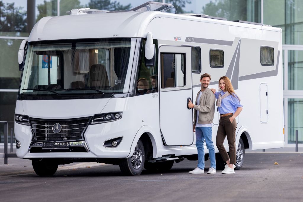 A couple entering a Mercedes-Benz RV during the Caravan Salon motorhome and caravan trade fair
