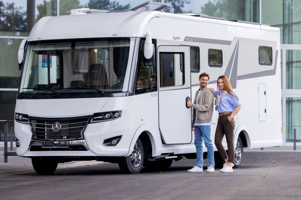 A couple entering a Mercedes-Benz RV during the Caravan Salon motorhome and caravan trade fair
