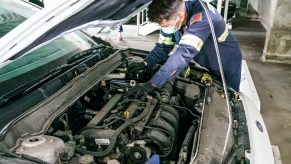 a mechanic works on a car