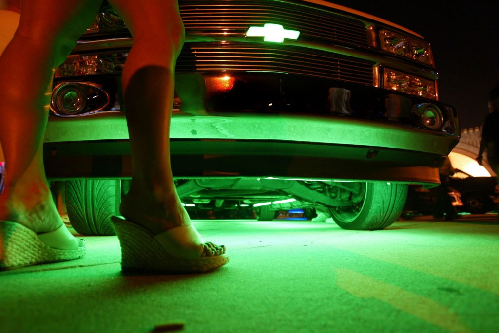 Neon glows from under a truck during the Spring Break Nationals Glowoff Competition.
