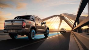 the 2021 Nissan Navara driving over a bridge