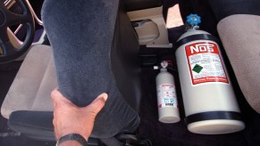 A Nitrous Oxide bottle mounted on the floor in the back seat of this Honda is what gives the car its extra speed under racing conditions