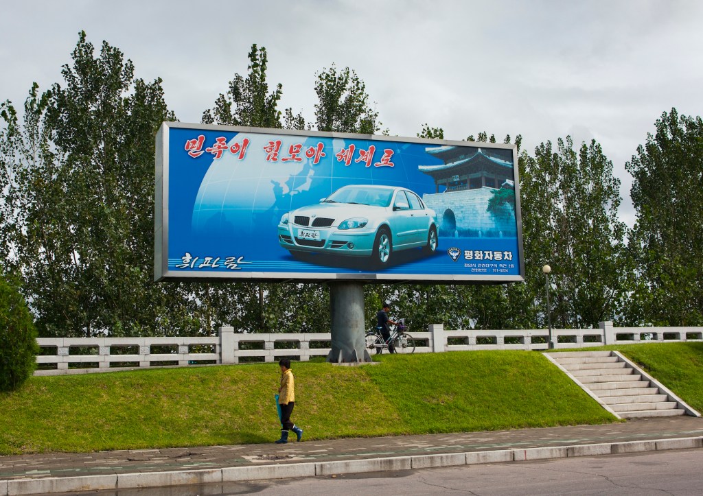 Pyeonghwa motors car advertising billboard, Pyongan Province, Pyongyang, North Korea.