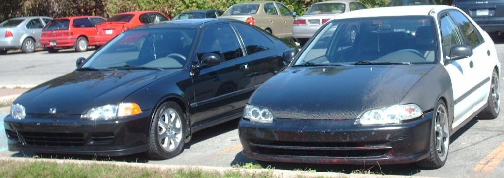 Two 1995 Honda Civics parked next to each other