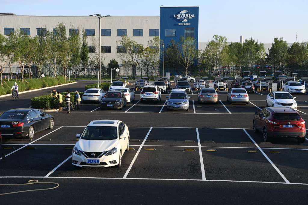 Cars sit parked at a parking lot outside Universal Beijing Resort on August 24, 2021 in Beijing, China.