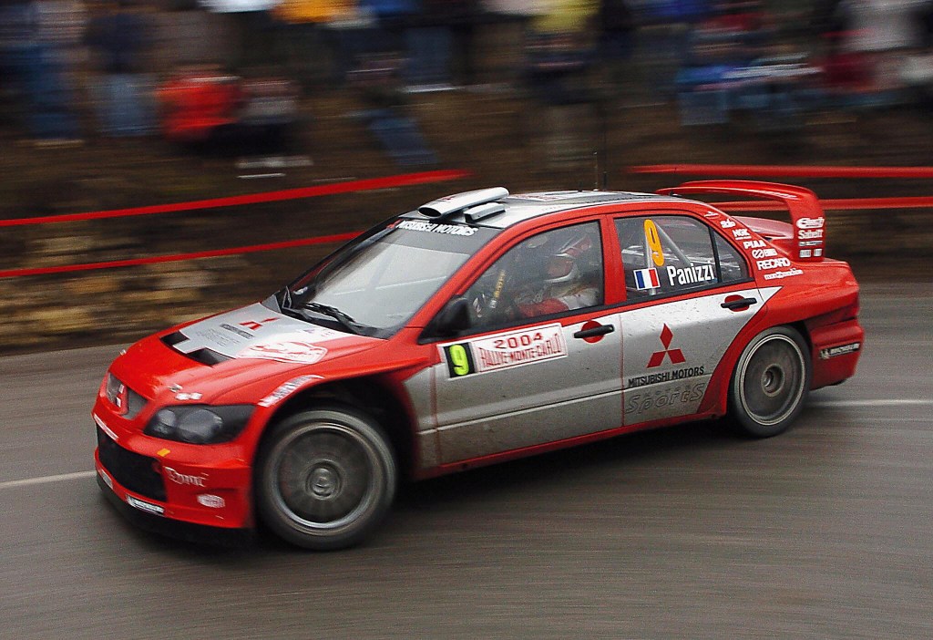 French Gilles Panizzi and his co-pilot Herve Panizzi take a turn in their Mitsubishi Lancer WRC04 during their practice session, before the 72nd Monte Carlo Rally.