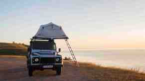 rooftop tent pitched next to cliff