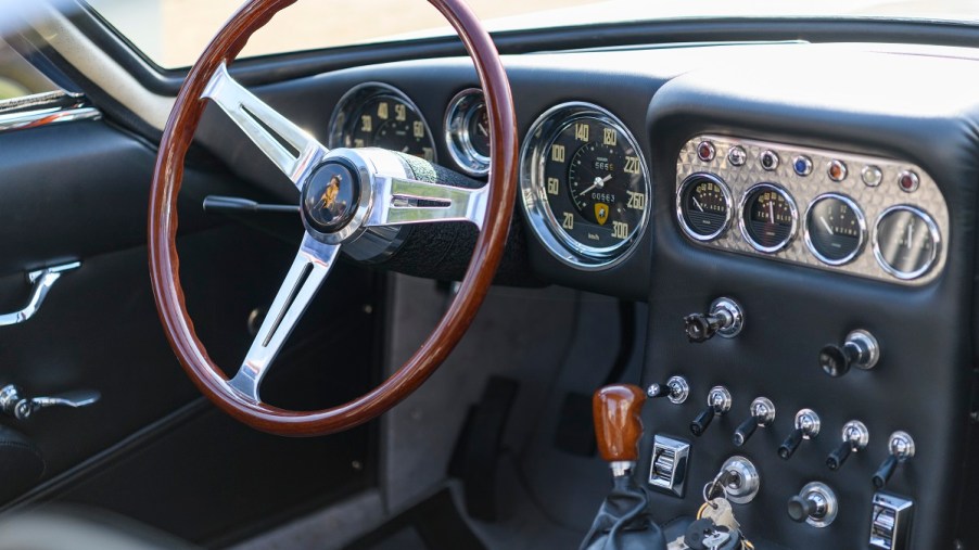 The inside of a car with a manual transmission.