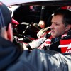 Tony Stewart sits in the driver's seat of a racecar.
