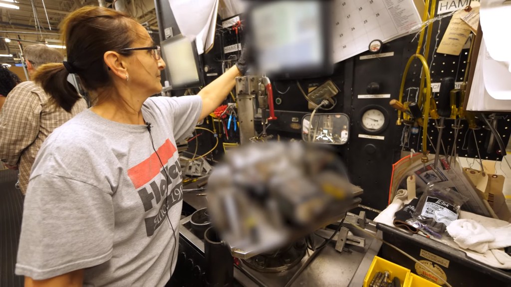 An Holley Performance employee using their secret proprietary carburetor testing machine.