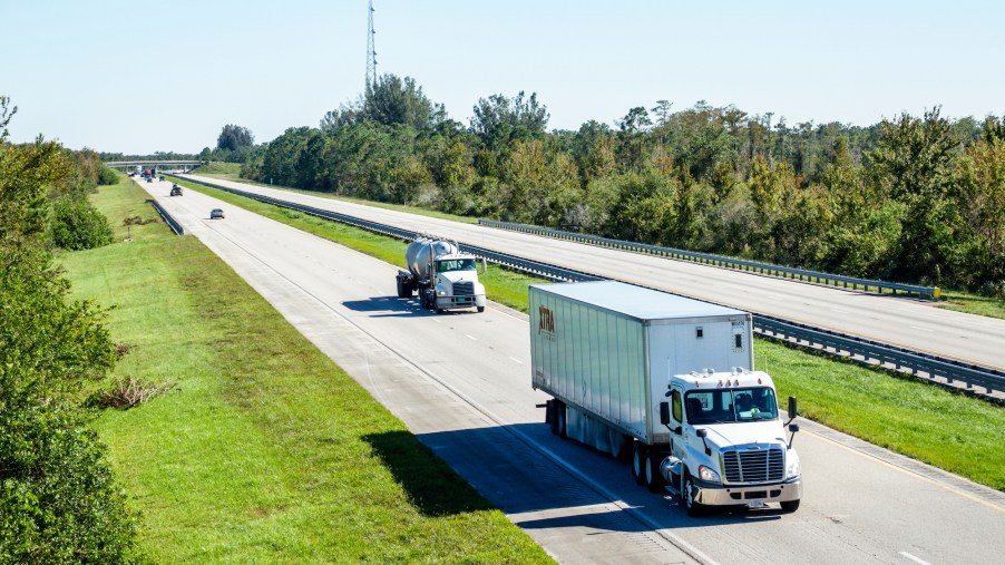 A tractor-trailer and a concrete truck on Florida's Turnpike