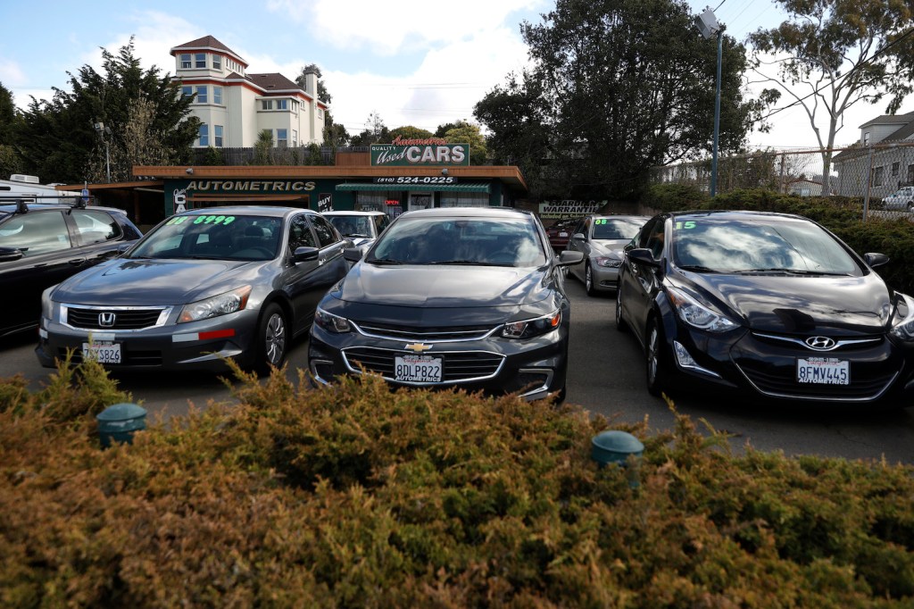 Used cars sit on the sales lot at Autometrics Quality Used Cars on March 15, 2021 in El Cerrito, California