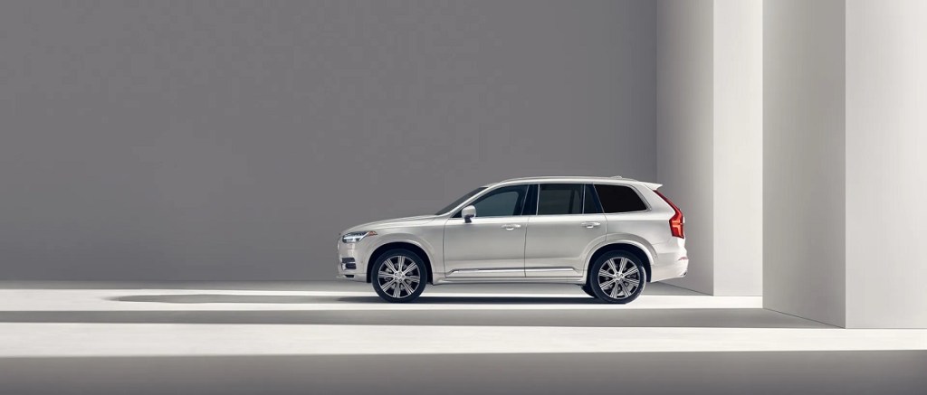 An ice-white 2021 Volvo XC90 in a white room.