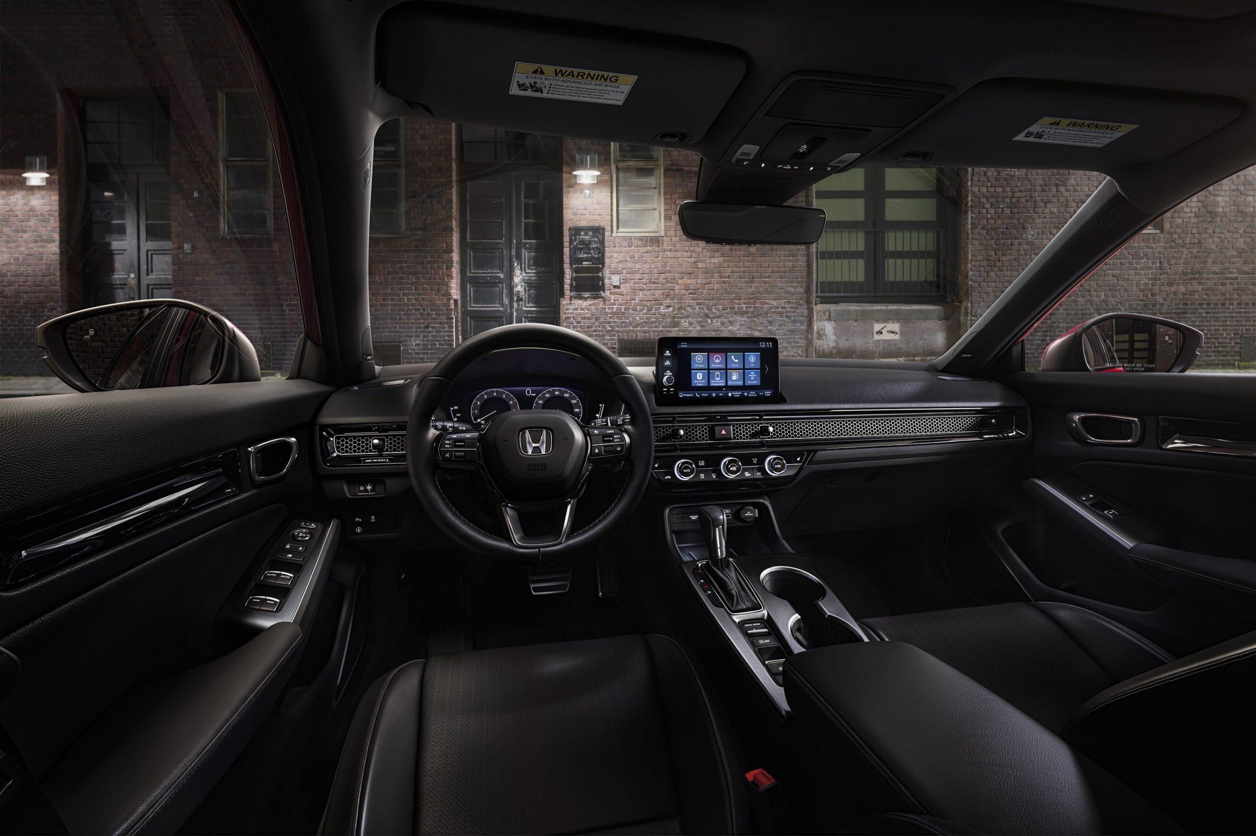 The 2022 Honda Civic interior shot from the driver's seat at night