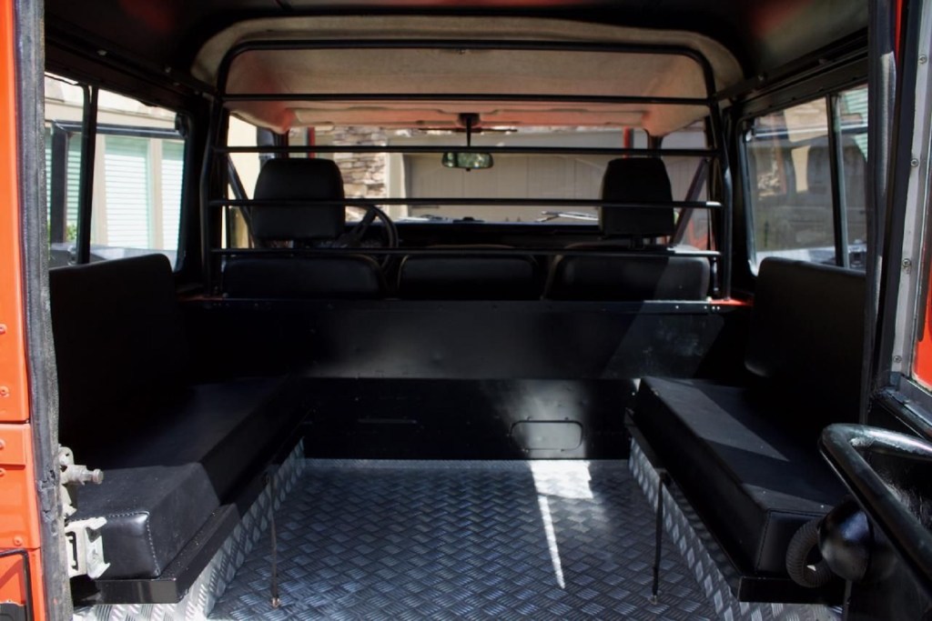 A rear view of a modified 1987 Land Rover 'Defender' 90's rear jump seats and front seats