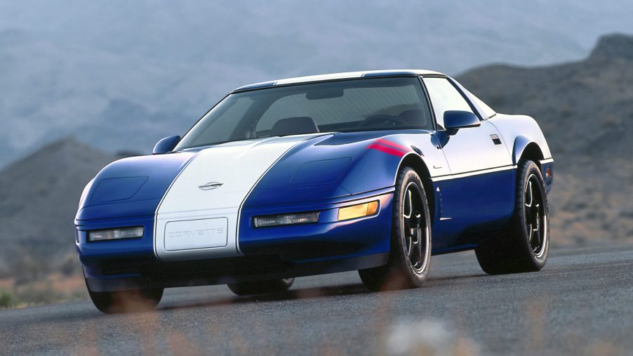 A blue and white-striped Chevy Corvette C4 Grand Sport shot from the front 3/4 angle