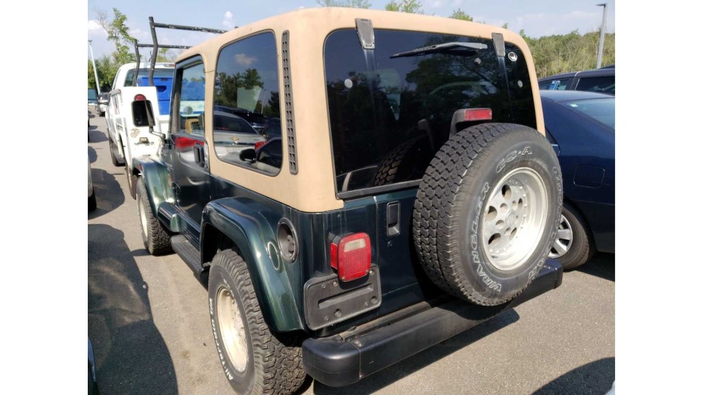 a green 1997 Jeep Wrangler TJ