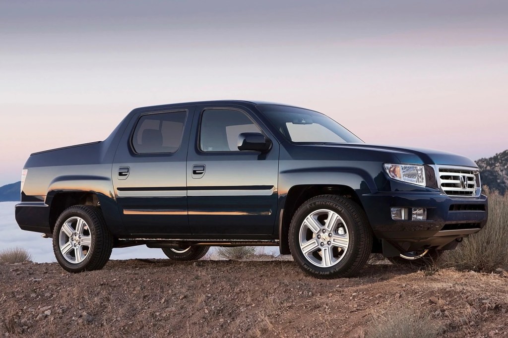 a black 2014 Honda Ridgeline parked on a hill - one of the best used pick up trucks under $20,000