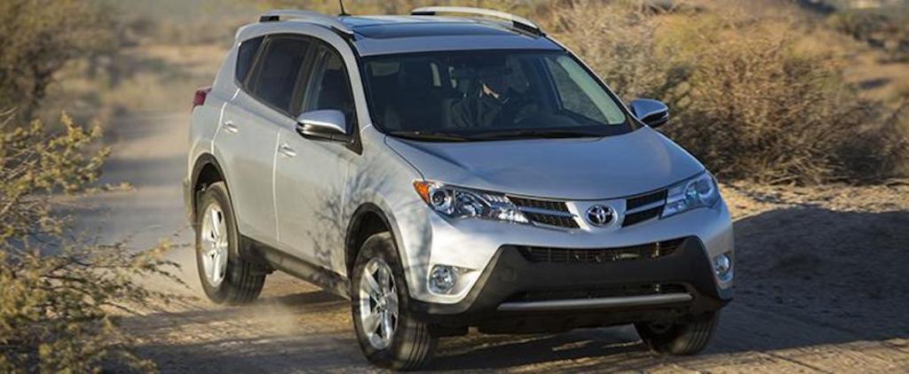 A 2015 Toyota RAV4 XLE parked on a dusty dirt road