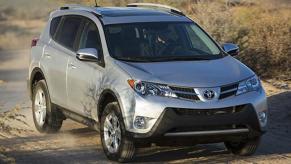 A 2015 Toyota RAV4 XLE parked on a dusty dirt road