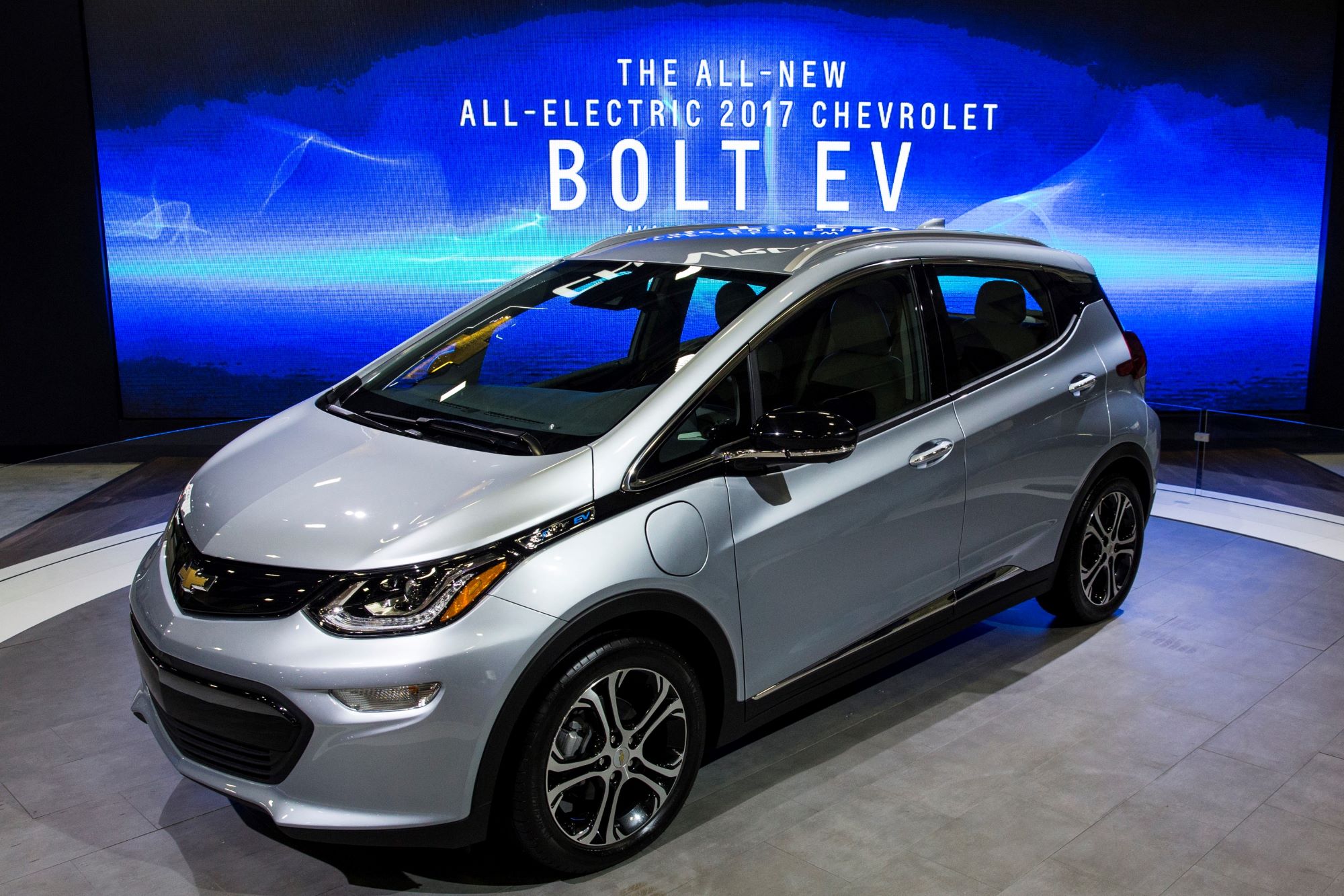 A silver 2017 Chevy Bolt, which has among those recalled, against a blue background with white print on it.