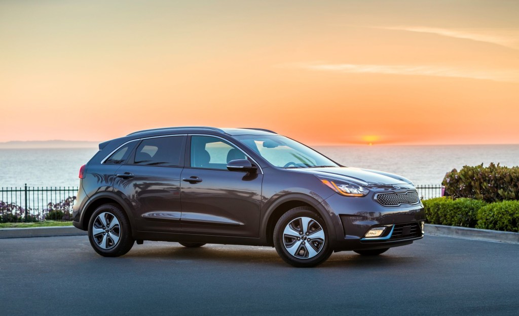 A black 2018 Kia Niro Plug-in hybrid parked at night