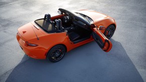 A 2019 Mazda MX-5 Miata convertible parked on pavement