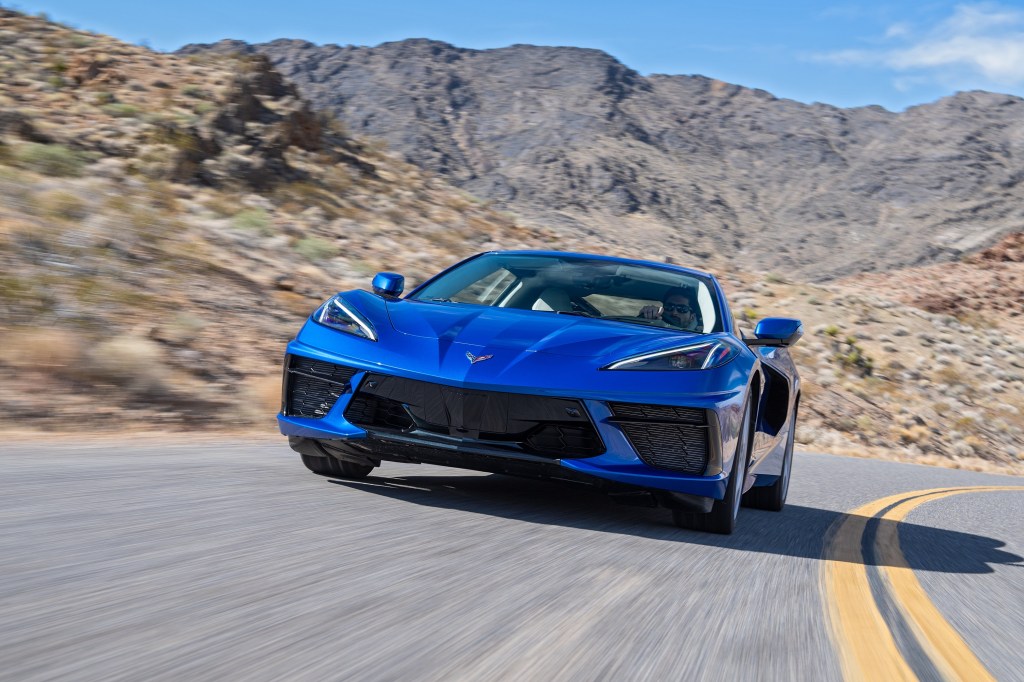 This blue 2022 Chevrolet Corvette is a direct descendant of the Chevy Corvette Indy concept, seen here from the front on a canyon road