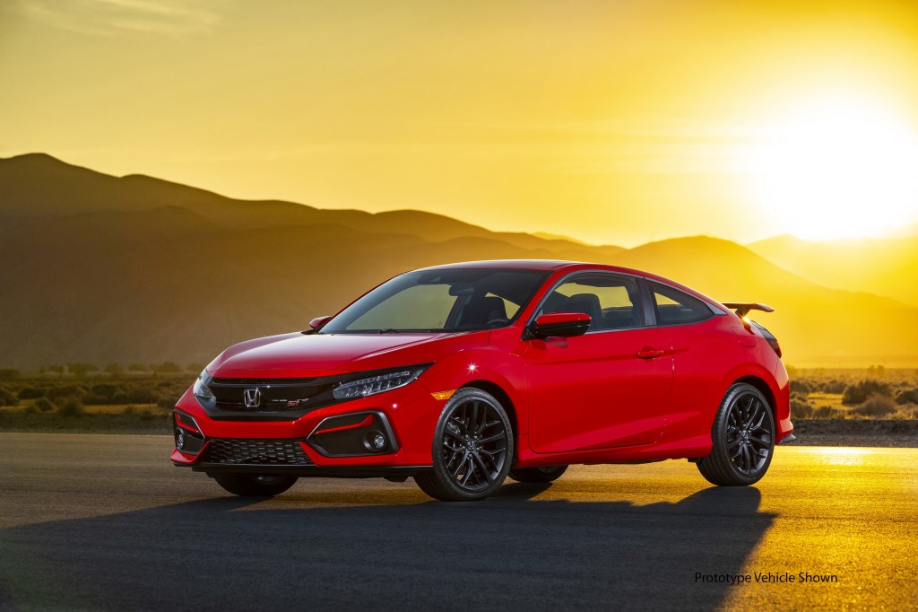 A red 2020 Civic Si coupe shot at sunset from the front 3/4 angle