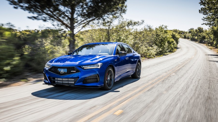 2021 Acura TLX Type S in blue driving down the road