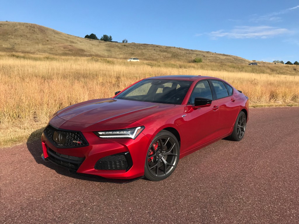 A front shot of the 2021 Acura TLX Type S next to a field for our full review