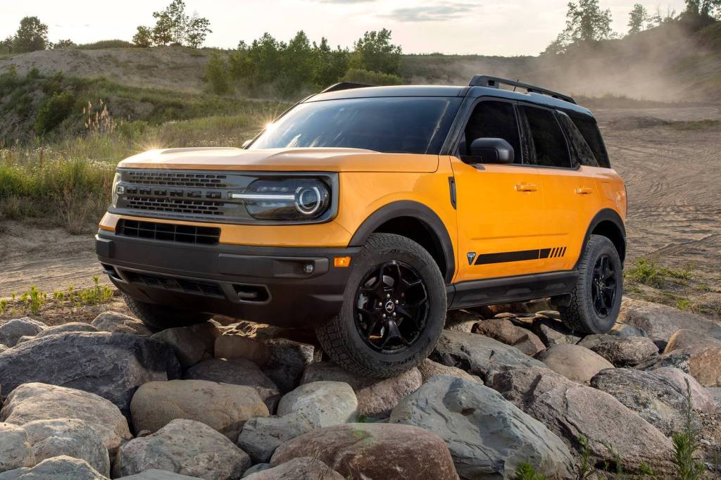 A yellow 2021 Ford Bronco Sport parked on some rocks