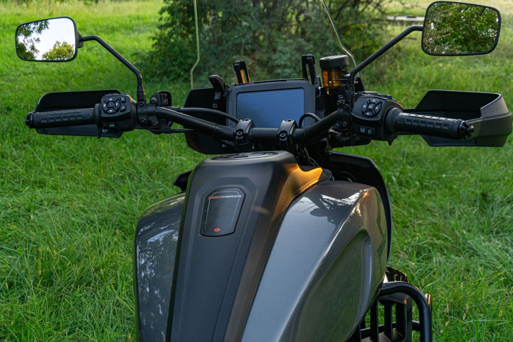 The overhead rear view of a gray-and-black 2021 Harley-Davidson Pan America 1250 Special's handlebars, TFT display, and windscreen