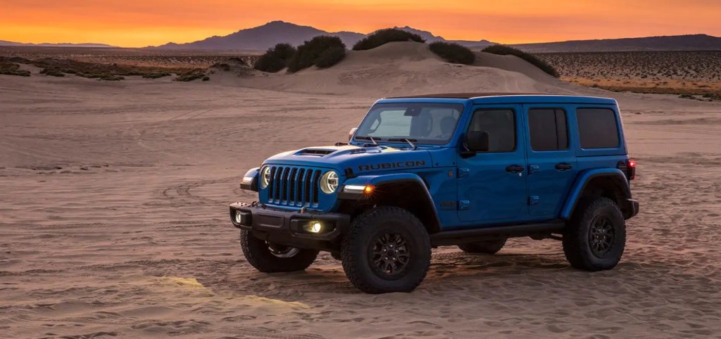 A blue 2021 Jeep Wrangler parked in the desert