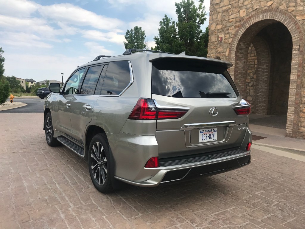 Rear three-quarter shot of the 2021 Lexus LX 570 as it sits in a parking lot driveway for our full review.