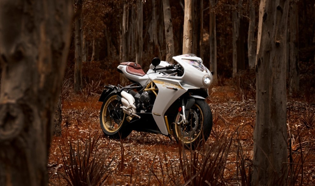 A white-and-gold 2021 MV Agusta Superveloce 800 S in a fall forest
