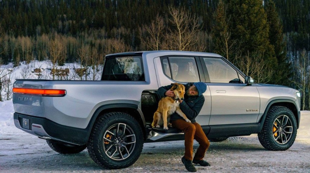 This is a promotional photo of a silver Rivian R1T electric truck. The Rivian electric pickup is the first to market.